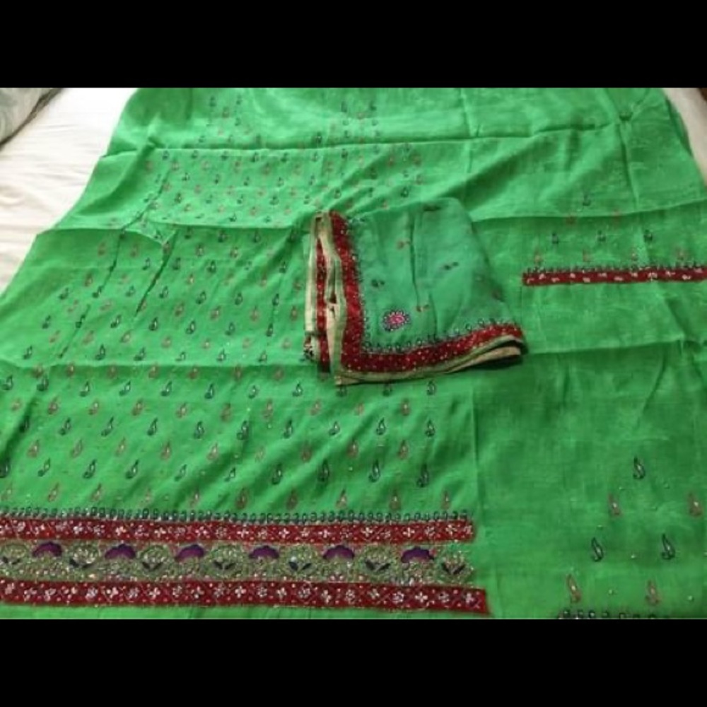 Unstitched silk green woman’s suit